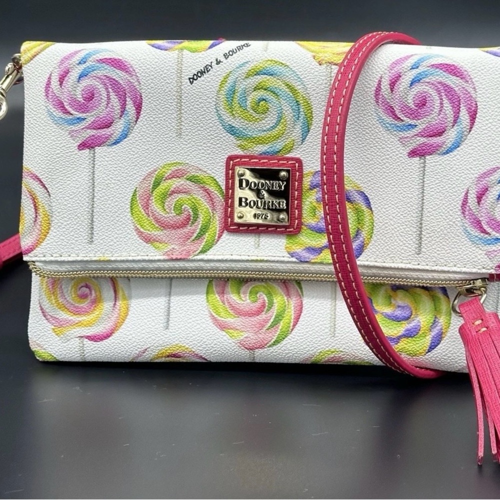 Dooney & Bourke White Lollipop Print fold-over Crossbody with Pink Strap